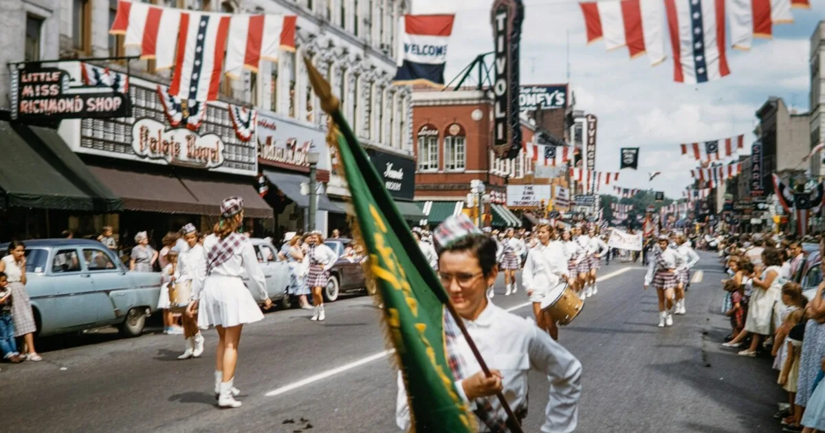 A historic emancipation march and freedom parade moving down a flag-lined main street in celebration of Juneteenth