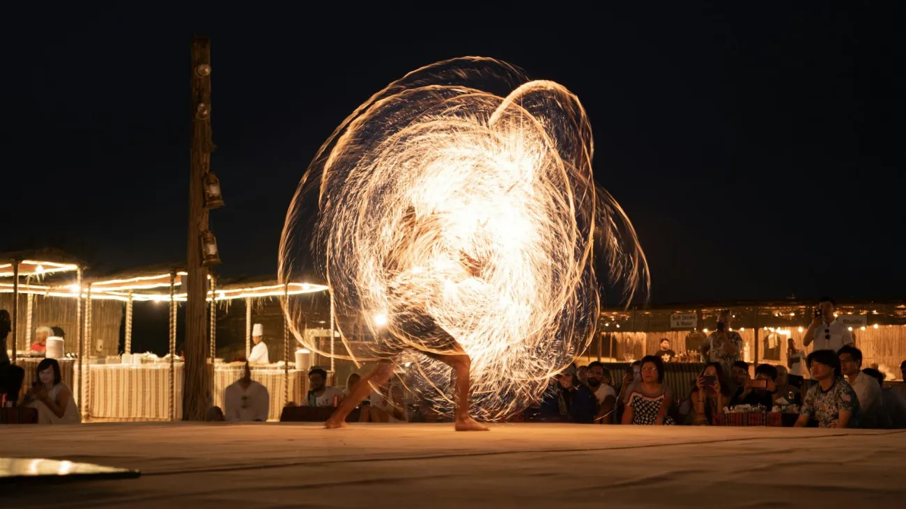 Fire show performer creating a spiral of light