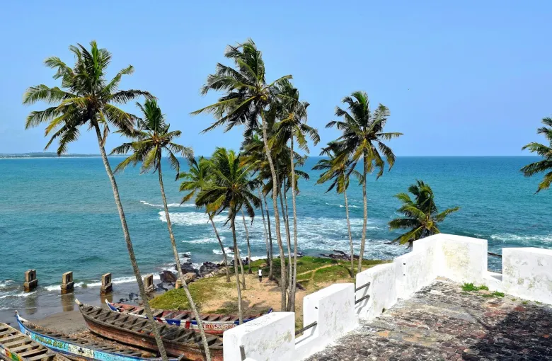 Elmina Castle in Ghana overlooking the Atlantic Ocean, a historic site on Ghana heritage tours and African diaspora travel jo