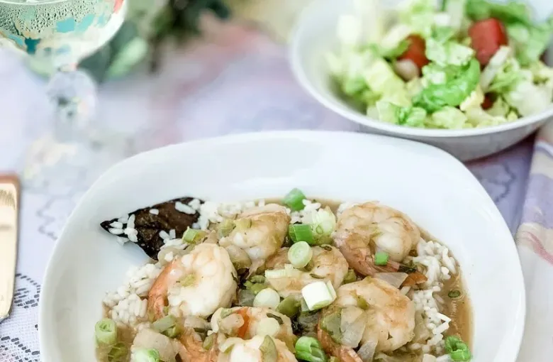 A bowl of Louisiana Creole shrimp served over rice, a classic New Orleans dish