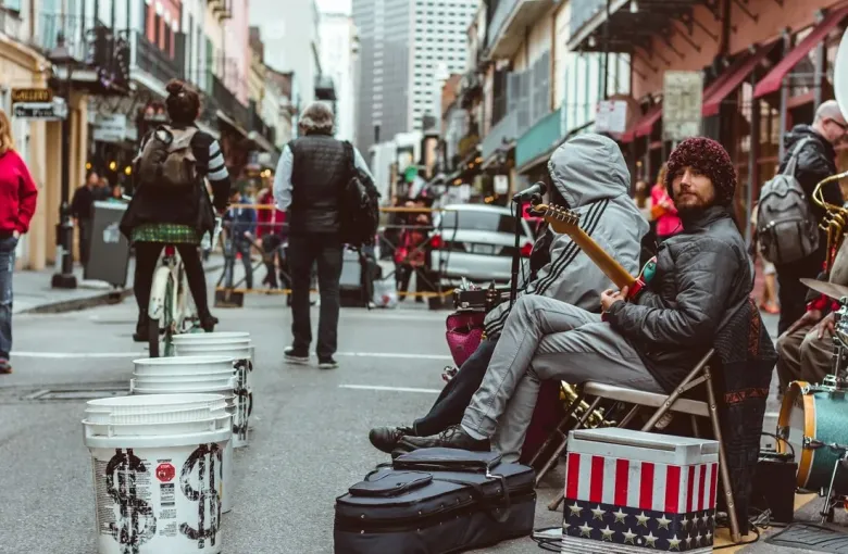 Street musicians performing live jazz with brass instruments on Frenchmen Street in New Orleans